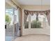 Dining area with large windows and sliding door for natural light and backyard access at 2868 Foxtail Creek Ave, Henderson, NV 89052