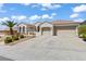 Beautiful single-story home showcasing a well-manicured lawn, palm tree, and convenient three-car garage at 2868 Foxtail Creek Ave, Henderson, NV 89052
