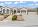 Charming single-story home featuring a three-car garage, mature landscaping, and a tile roof at 2868 Foxtail Creek Ave, Henderson, NV 89052