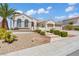 Lovely single-story house with a three-car garage, landscaped yard, and stone accents at 2868 Foxtail Creek Ave, Henderson, NV 89052