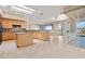 Open-concept kitchen boasts an island and granite countertops with access to outdoor living space at 2868 Foxtail Creek Ave, Henderson, NV 89052