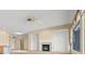 Living room features tile flooring, ceiling fan, fireplace, and lots of natural light at 2868 Foxtail Creek Ave, Henderson, NV 89052