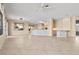 Spacious living room featuring tile floors, a ceiling fan, and a decorative chandelier at 2868 Foxtail Creek Ave, Henderson, NV 89052