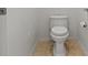 Cozy half-bathroom featuring a standard toilet and tiled floors at 2868 Foxtail Creek Ave, Henderson, NV 89052