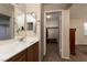 Bathroom with a single sink vanity and a walk-in closet at 3120 Inlet Bay Ave, North Las Vegas, NV 89031