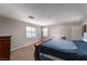 Bedroom featuring plush carpeting, two windows for natural light, and ample closet space at 3120 Inlet Bay Ave, North Las Vegas, NV 89031