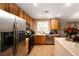 Bright kitchen with stainless steel appliances, ample cabinet space, and a breakfast bar at 3120 Inlet Bay Ave, North Las Vegas, NV 89031