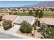 A high, aerial view of the home and surrounding neighborhood with mountain views at 3312 Lapwing Dr, North Las Vegas, NV 89084