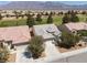 A high, aerial view of the home and surrounding neighborhood, next to the golf course at 3312 Lapwing Dr, North Las Vegas, NV 89084