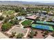 Aerial view of a community center with a pool, tennis courts, and a playground at 3312 Lapwing Dr, North Las Vegas, NV 89084