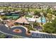 A high, aerial view of the community center, pool, and tennis courts at 3312 Lapwing Dr, North Las Vegas, NV 89084