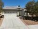 Charming home with a two-car garage and desert landscaping for low maintenance at 3312 Lapwing Dr, North Las Vegas, NV 89084