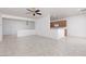 Open-concept living area combining living and kitchen spaces, featuring tile flooring at 3312 Lapwing Dr, North Las Vegas, NV 89084