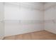 Spacious walk-in closet with carpet floors and featuring multiple levels of wire shelving for optimal storage at 3312 Lapwing Dr, North Las Vegas, NV 89084