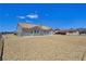 Charming single-story home with a tile roof and a spacious backyard with stone ground cover at 3326 Mount Charleston Dr, Pahrump, NV 89048