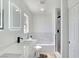 Bathroom features a sleek vanity with an illuminated mirror and a tiled shower at 3326 Mount Charleston Dr, Pahrump, NV 89048