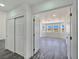 Bright and airy bedroom featuring hardwood floors, three windows and closet with sliding doors at 3326 Mount Charleston Dr, Pahrump, NV 89048