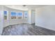 Spacious bedroom featuring three windows, hardwood floors and a large closet at 3326 Mount Charleston Dr, Pahrump, NV 89048