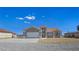Charming single-story home boasts a neutral color scheme, concrete driveway and a two-car garage at 3326 Mount Charleston Dr, Pahrump, NV 89048