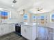 Bright kitchen with white cabinetry, quartz countertops, stainless steel appliances and hardwood flooring at 3326 Mount Charleston Dr, Pahrump, NV 89048