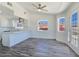 Bright kitchen and dining area with stainless steel appliances, white cabinetry, and views at 3326 Mount Charleston Dr, Pahrump, NV 89048