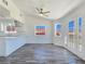 Bright kitchen and dining area with stainless steel appliances, white cabinetry, and views at 3326 Mount Charleston Dr, Pahrump, NV 89048