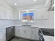 Bright kitchen featuring stainless steel appliances, white cabinets, and quartz countertops at 3326 Mount Charleston Dr, Pahrump, NV 89048