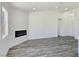 Modern living space featuring gray floors, white walls, recessed lighting and an electric fireplace at 3326 Mount Charleston Dr, Pahrump, NV 89048