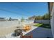 Private backyard with a fire pit, rock landscaping, and a small lawn at 3440 Ernest St, North Las Vegas, NV 89032