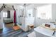 Spa-like bathroom with glass shower, soaking tub, and modern fixtures at 3440 Ernest St, North Las Vegas, NV 89032