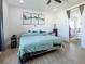 Inviting primary bedroom featuring plank floors and ensuite bathroom at 3440 Ernest St, North Las Vegas, NV 89032