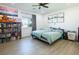 Bright primary bedroom with plank flooring, ceiling fan, and lots of natural light at 3440 Ernest St, North Las Vegas, NV 89032