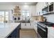Stylish kitchen featuring white cabinets, stainless steel appliances, and ample counter space at 3440 Ernest St, North Las Vegas, NV 89032
