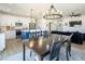 Open-concept living space combining the kitchen, dining area, and living room at 3440 Ernest St, North Las Vegas, NV 89032