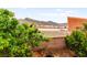 Backyard features plants, rocks, and views of the surrounding mountains at 3619 Hat Rock Ct, Las Vegas, NV 89129