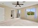 Spacious bedroom featuring a ceiling fan, natural light, and access to a balcony at 3619 Hat Rock Ct, Las Vegas, NV 89129