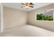 Bedroom featuring neutral colored walls, ceiling fan, and a sunlit window at 3619 Hat Rock Ct, Las Vegas, NV 89129