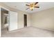 Bedroom features ceiling fan and access to closet, bedroom, and bathroom at 3619 Hat Rock Ct, Las Vegas, NV 89129