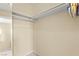 Walk-in closet features neutral paint and shelving for optimal storage at 3619 Hat Rock Ct, Las Vegas, NV 89129