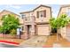 Inviting two-story home with a balcony, manicured landscaping, and a one-car garage at 3619 Hat Rock Ct, Las Vegas, NV 89129