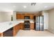 A kitchen with stainless steel appliances, tile floors and plenty of cabinet space at 3619 Hat Rock Ct, Las Vegas, NV 89129