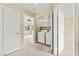 A carpeted laundry room area features new, modern washer and dryer units at 3619 Hat Rock Ct, Las Vegas, NV 89129