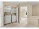 Laundry room features newer washer and dryer next to bedroom entrance at 3619 Hat Rock Ct, Las Vegas, NV 89129