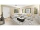 Bright, staged living room features a modern sectional sofa and stylish decor at 3619 Hat Rock Ct, Las Vegas, NV 89129