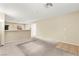 Spacious living room featuring carpet floors, neutral walls, and abundant natural light at 3619 Hat Rock Ct, Las Vegas, NV 89129