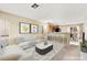 Bright living room with stylish furniture, modern decor, and an open view to the kitchen at 3619 Hat Rock Ct, Las Vegas, NV 89129