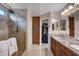 Bathroom with double sinks, granite countertop, walk in shower and access to the walk-in closet at 3712 Rocklin Peak Ave, North Las Vegas, NV 89081