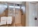Walk-in shower with tiled walls, mosaic accents, and built-in niche offers a spa-like experience at 3712 Rocklin Peak Ave, North Las Vegas, NV 89081