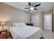 Bedroom with ceiling fan, closet, and adjacent bathroom at 3712 Rocklin Peak Ave, North Las Vegas, NV 89081