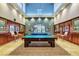 Elegant billiard room featuring high ceilings, detailed woodwork, and ample lighting at 3712 Rocklin Peak Ave, North Las Vegas, NV 89081